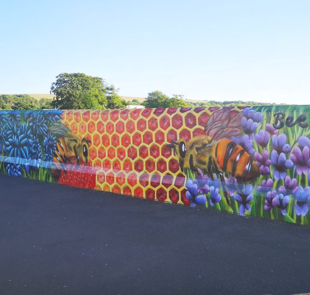 A bee mural in Falmer Station in Brighton, England 