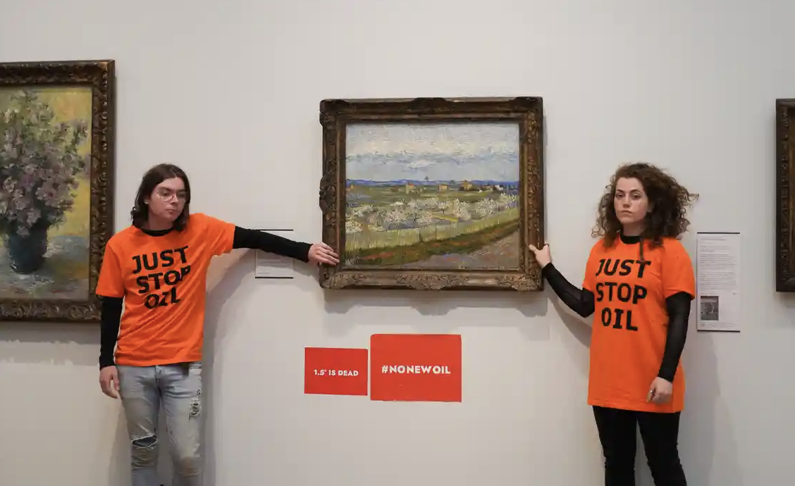 protesters destroy art
